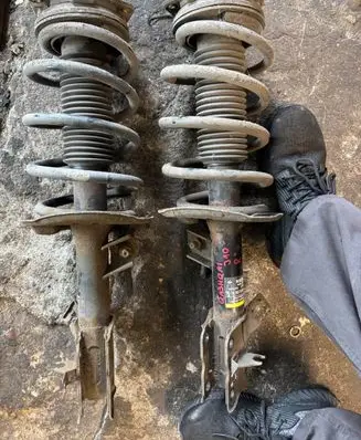 Nissan Qashqai Front shock absorber with coil spring 32323