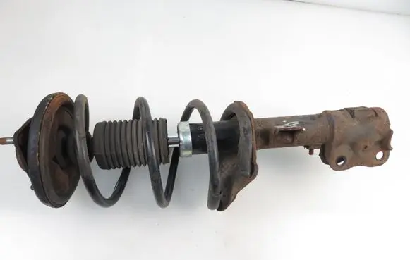 Mitsubishi Lancer VIII Front shock absorber with coil spring