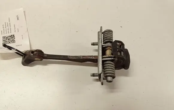 Front door check strap stopper