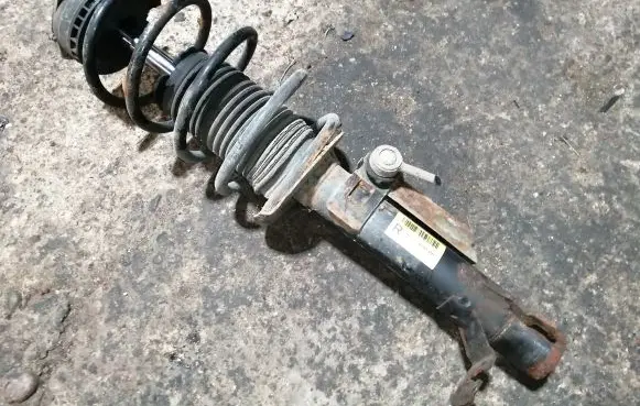 Mazda 2 Front shock absorber with coil spring 3M7118045BA