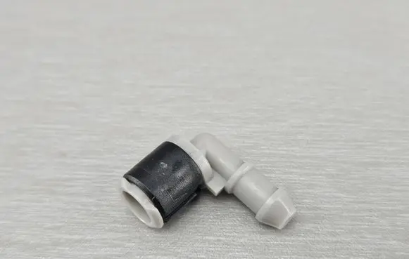 Windshield washer spray nozzle