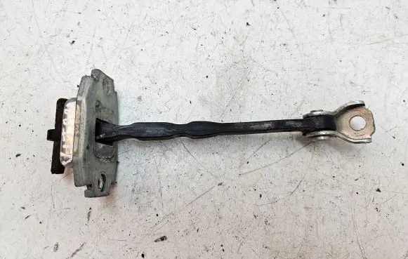Front door check strap stopper