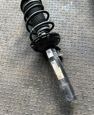 Volkswagen Golf VIII Front shock absorber with coil spring 5WA412038KB