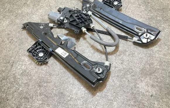 Rear door window regulator with motor
