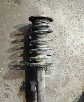 Front shock absorber with coil spring