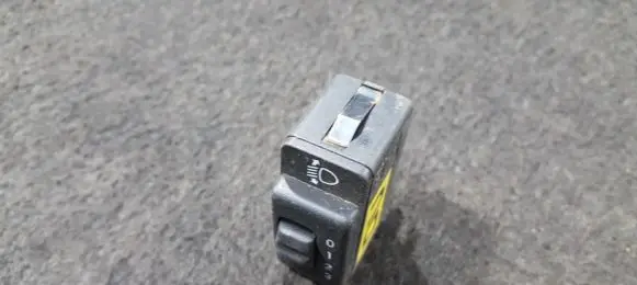 Headlight level height control switch
