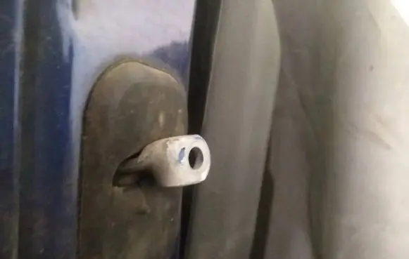 Front door check strap stopper