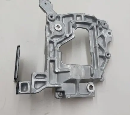 Nissan Leaf II (ZE1) A/C compressor mount bracket 201011C115