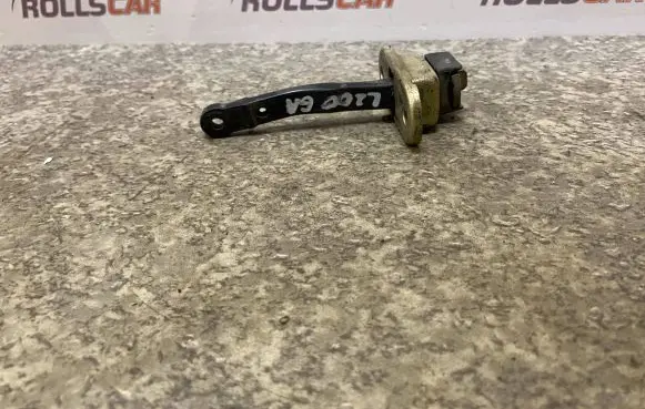Mitsubishi L200 Rear door check strap stopper