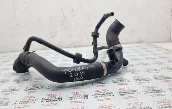 Volkswagen Touran II Engine coolant pipe/hose 1K0121087AH