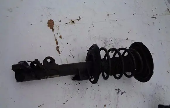 Front shock absorber with coil spring