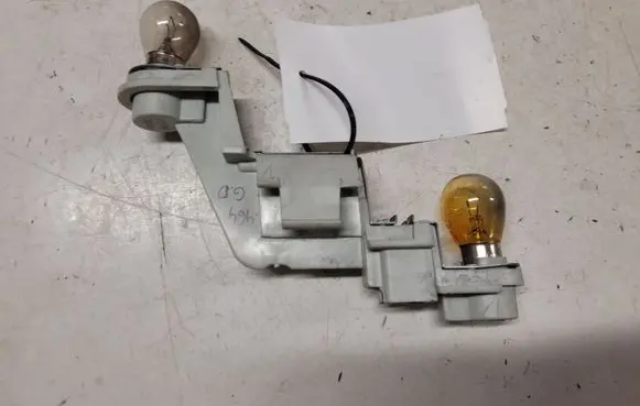 Tail light bulb cover holder