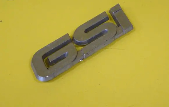 Mazda 323 Manufacturers badge/model letters 
