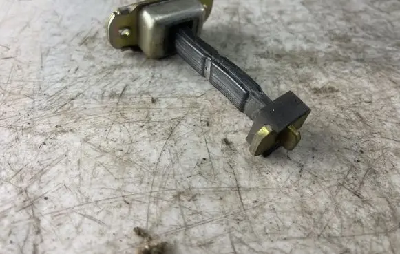 Mitsubishi Pajero Sport I Rear door check strap stopper