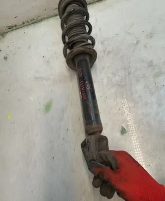 Infiniti Q50 Front shock absorber with coil spring 112