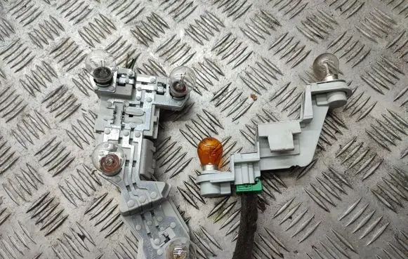 Volvo V50 Tail light bulb cover holder