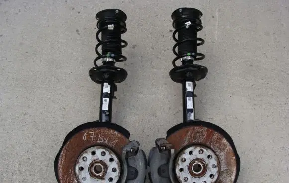 Volkswagen Golf VII Front shock absorber with coil spring 5Q0413023FK