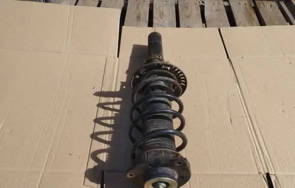Volkswagen Fox Front shock absorber with coil spring 5Z0413031AB