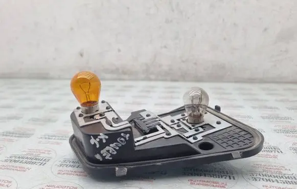 Volkswagen Touareg I Tail light bulb cover holder 7L6945257