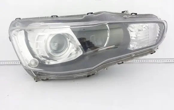 Mitsubishi Lancer VIII Headlight/headlamp 9955949700