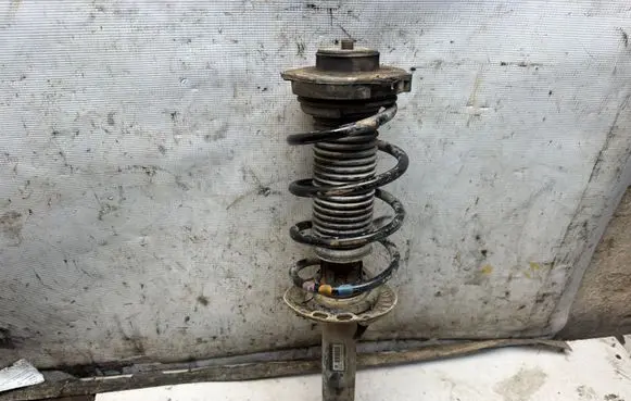 Volkswagen Golf V Front shock absorber with coil spring 1K0413031BH