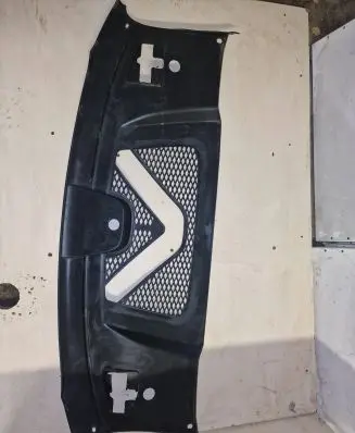 Engine bonnet/hood lock trim molding