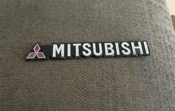 Mitsubishi Lancer Manufacturers badge/model letters 