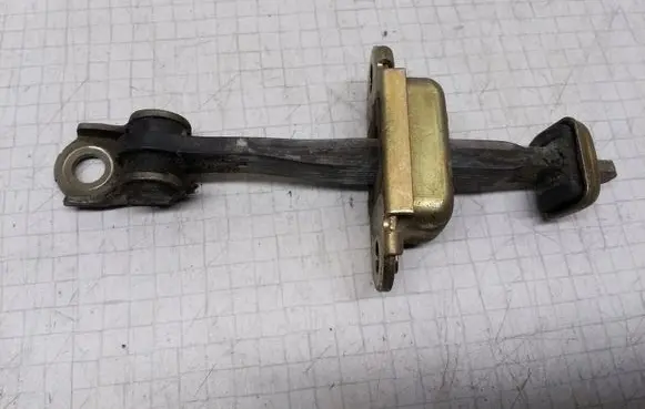 Nissan Primera Rear door check strap stopper