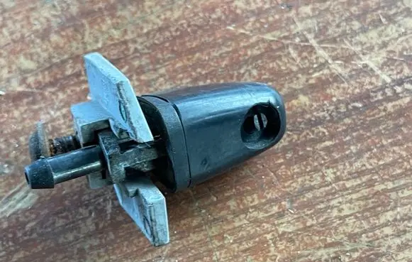Headlight washer spray nozzle