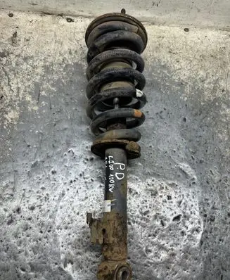 Mitsubishi L200 Front shock absorber with coil spring