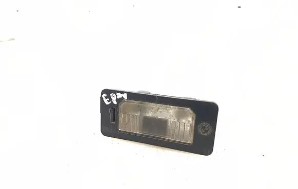 Trunk door license plate light bar