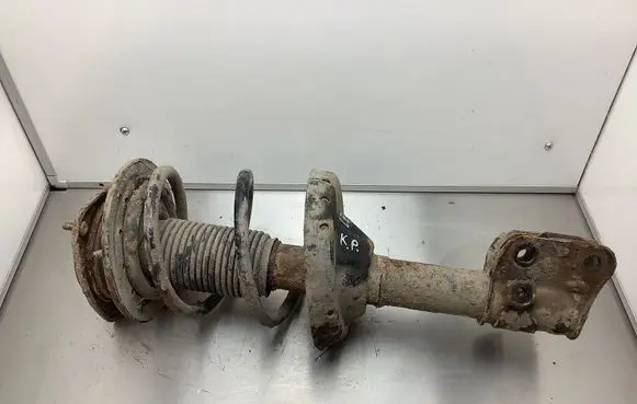 Subaru Legacy Front shock absorber with coil spring 