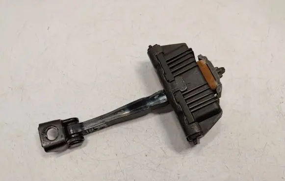 Front door check strap stopper