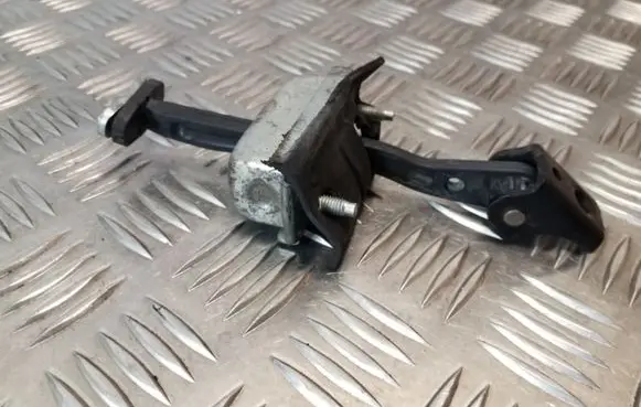 Front door check strap stopper