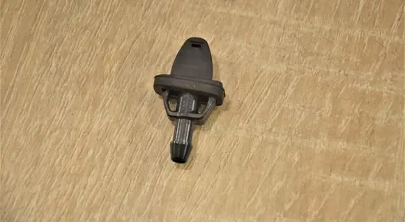 Windshield washer spray nozzle