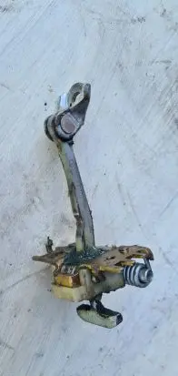 Front door check strap stopper