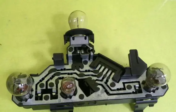 Tail light bulb cover holder