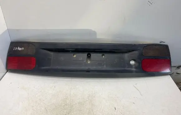 Trunk door license plate light bar