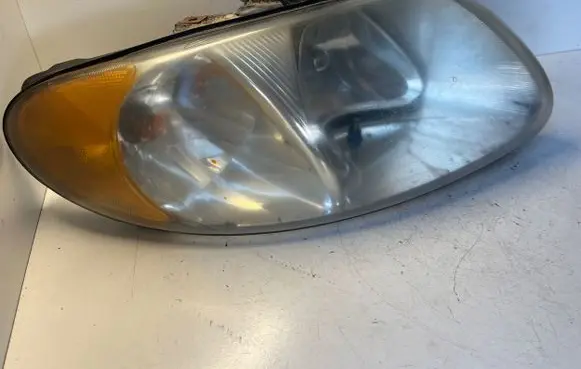 Chrysler Voyager Headlight/headlamp 04857700AB
