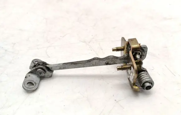 Front door check strap stopper