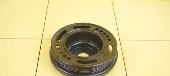 Opel Corsa D Timing belt tensioner pulley 55559328 A16LER