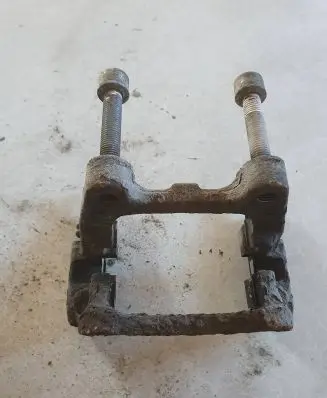 Volkswagen PASSAT B6 Brake caliper pad carrier rear 