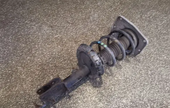 Front shock absorber with coil spring