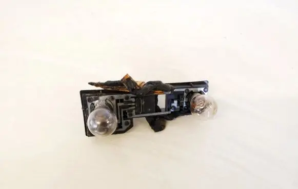 Nissan Primera Tail light bulb cover holder