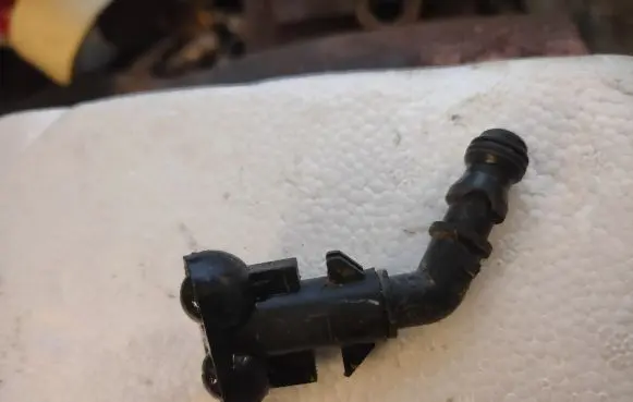 Chrysler Grand Voyager V Headlight washer spray nozzle