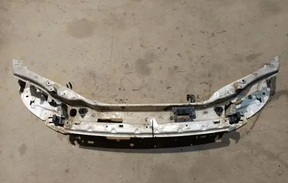 Radiator support slam panel