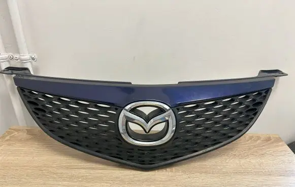 Mazda 3 I Front bumper upper radiator grill BN8V50711