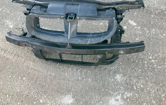 Top upper radiator support slam panel