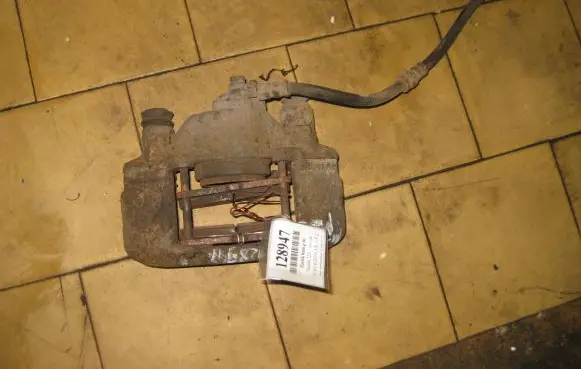 Mazda 323 F Front brake caliper