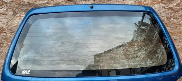 Mazda Demio Front vent window/glass (coupe) 